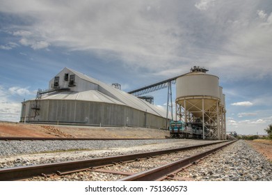 A wheat grain storage facility next tot he railway in rural Australia
