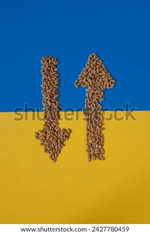 Wheat grains. Two arrows pointing in opposite directions. Ukraine flag. Grain dispute. Export quotas. Grain crisis. Diplomatic failure. Global world crisis. Stock photo © 