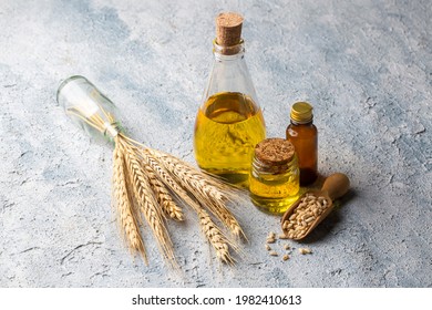 Wheat and wheat oil in bottles