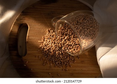 Wheat Seeds Under The Sunlight On Wood Chopper