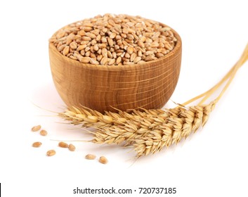 Wheat Spike And Wheat Grain In A Wooden Bowl Isolated On White Background