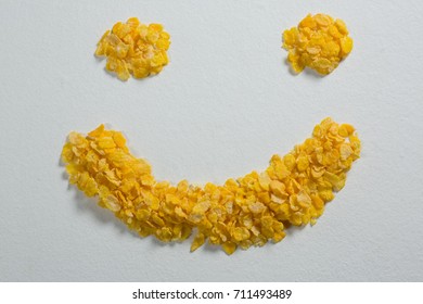 Wheaties cereal forming a smiley face on white background - Powered by Shutterstock