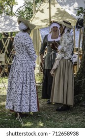 WHEATON, ILLINOIS/USA - SEPTEMBER 10, 2017: Three Women In Period Dress Enjoy A Chat Together In A Military Encampment At A Reenactment Of The American Revolutionary War (1775-1783).