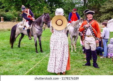 WHEATON, IL/USA - SEPT. 9, 2018: A Woman In Period Dress Wears A Round Hat Like A Target On Her Back During An Equestrian Demonstration At A Reenactment Of The American Revolutionary War (1775-1783).