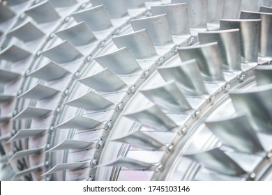 Wheel of the air compressor of an aircraft engine. Replacement of the jet engine.Turbine blades closeup. Shallow depth of field. - Powered by Shutterstock