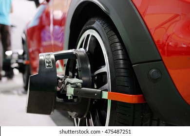 Wheel Alignment Equipment On A Car Wheel