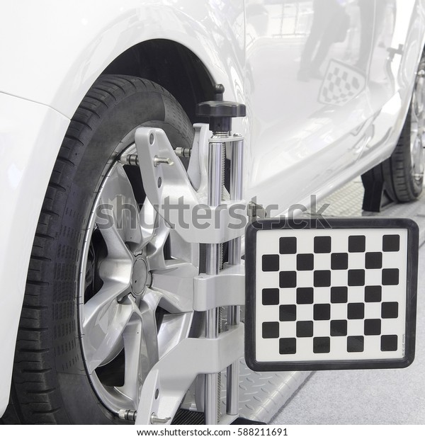  Wheel alignment\
equipment on a car