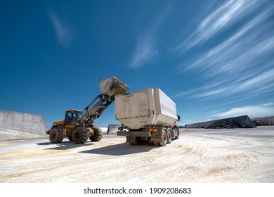 Wheel Bucket Loader Loads A Truck With Animal Feed