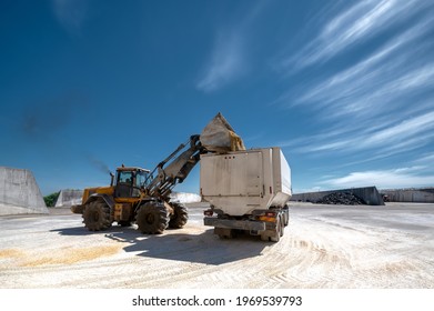 Wheel Bucket Loader Loads A Truck With Animal Feed