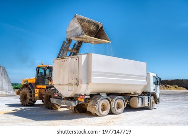 Wheel Bucket Loader Loads A Truck With Animal Feed