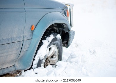 Wheel Of A Car Stuck In The Snow. Winter Tires. Car Tires For Snow And Ice.