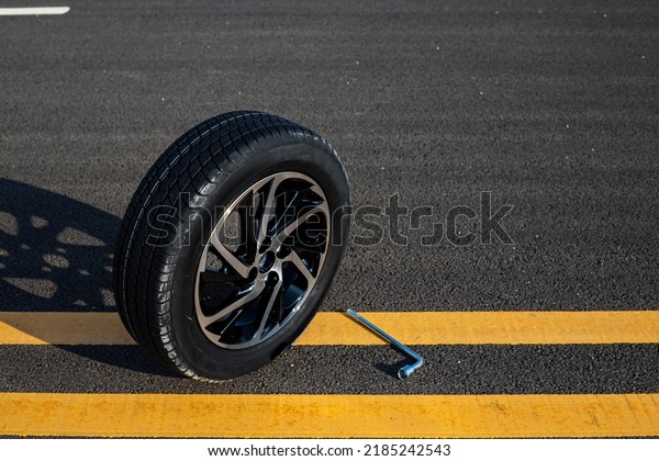 Wheel car, Car\
tire, Aluminum wheels or steel wheel isolated on street background.\
Car tires with a great profile in the car repair. image about tire\
beautiful. copy space for\
text.