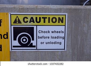 Wheel Chock Signage On Wall