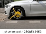 Wheel clamp or parking claw on a car front wheel