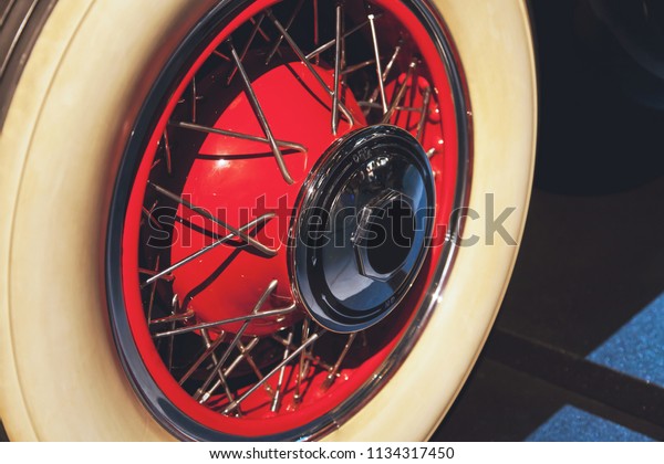 The wheel of a classic car, a museum, a\
restoration workshop, a\
rarity