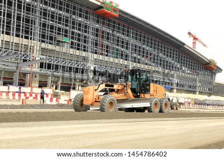 Wheel Dozer or Motorgrader work in construction site 