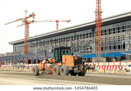 Wheel Dozer or Motorgrader work in construction site 