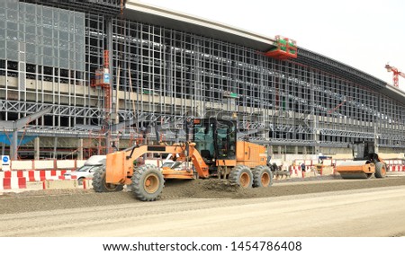 Wheel Dozer or Motorgrader work in construction site 