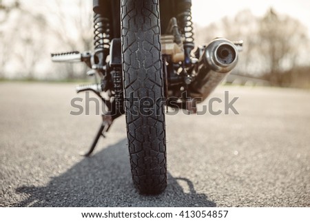 Image, Stock Photo Wheel and exhaust pipe of motorcycle on road