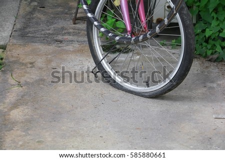 wheel flat tire of the bicycle old and cracked