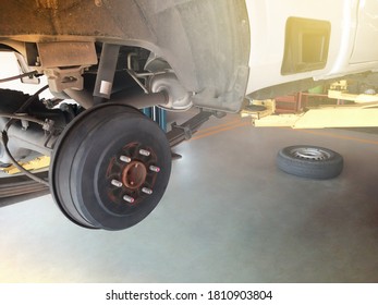 Wheel Hub And Truck Tire In Process Of Changing And Maintenance Pickup Truck Wheel Alignment In Service In A Garage. Focus On Wheel Hub.