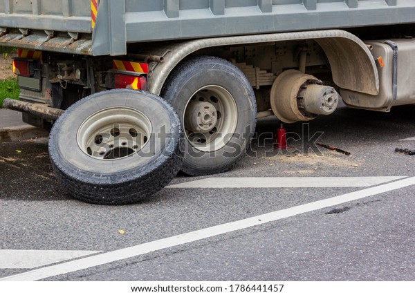 Wheel hub and truck tire in process of changing\
wheel nut. Maintenance a truck wheels hub and bearing. Rear wheels\
hub and bolt nut of a truck in process of changing wheel. Brake\
disc under