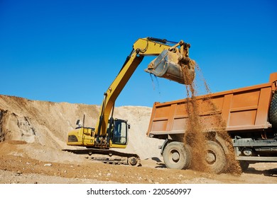 Wheel Loader Excavator Machine Loading Dumper Truck At Sand Quarry