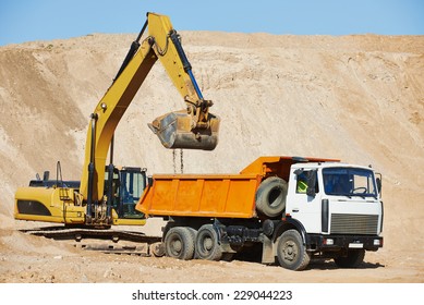 Wheel Loader Excavator Machine Loading Dumper Truck At Sand Quarry