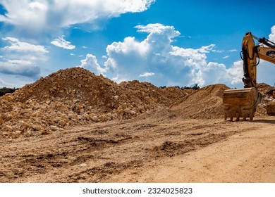 Wheel loader and excavator on a construction waste disposal site - Powered by Shutterstock