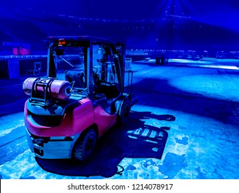 Wheel loader. Lifting cargo. Unloading. Loader on the empty site. Auxiliary equipment in production. Production.