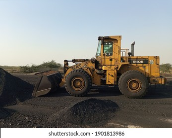 A wheel loader working in a coal yard    - Karachi Pakistan - Jan 2021