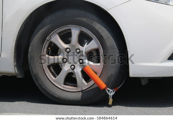 Wheel is lock on an\
illegal parked car.