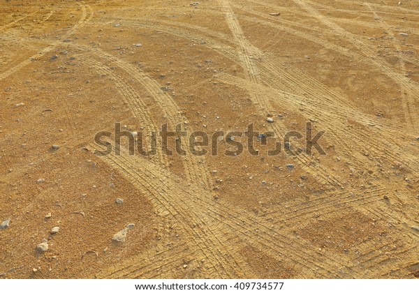 Wheel Mark on the\
gravel road.:Close up,select focus with shallow depth of\
field:ideal use for\
background.
