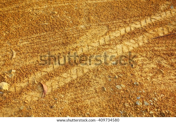 Wheel Mark on the\
gravel road.:Close up,select focus with shallow depth of\
field:ideal use for\
background.