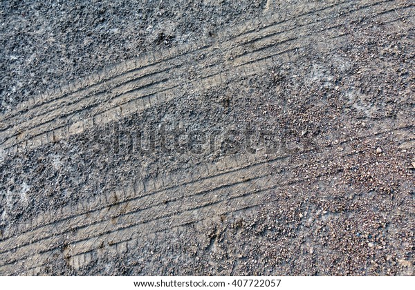 Wheel Mark on the soil road:Abstract for\
pattern background.\
