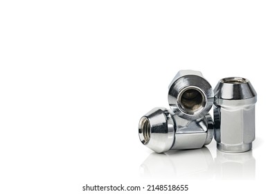 Wheel Nuts Isolated On White Background. Car Spare Part. Metal Nut Fastening The Car Wheel. Copy Space.