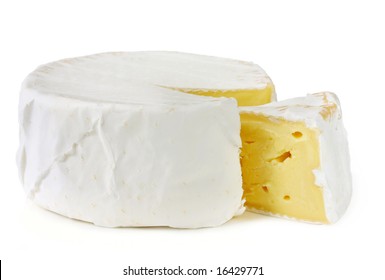 A Wheel Of Rich Creamy Brie Cheese, With A Wedge Cut Out.  Isolated On White.