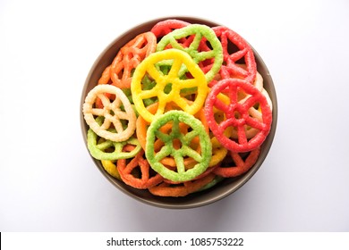 wheel shape colourful Fryums Papad is a crunchy Snack Pellets served in a bowl
