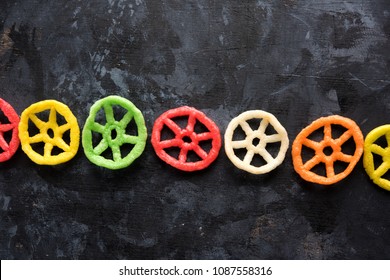 wheel shape colourful fryums papad snack. selective focus