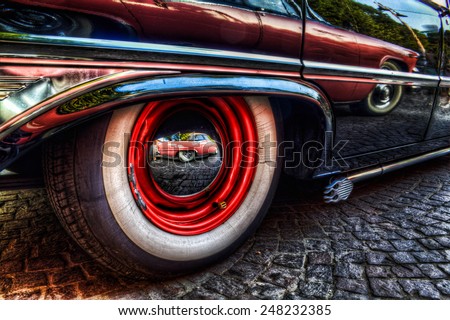 Wheel and side from a Ford Galaxie V8 1961, great american vintage car