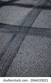 Wheel Tire Tracks On Grey Asphalt, Abstract Street Background, Vertical Format, No Person