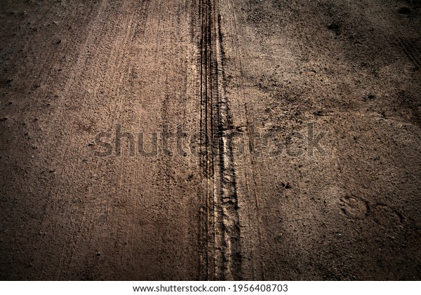 Wheel track on mud for\
background