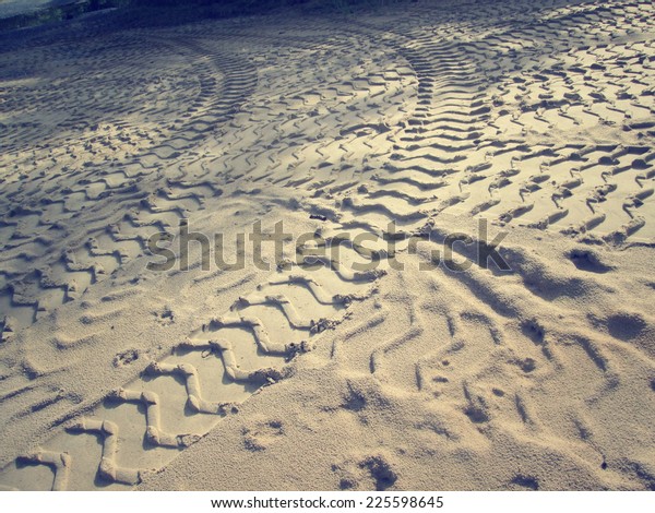 Wheel tracks on the\
soil.