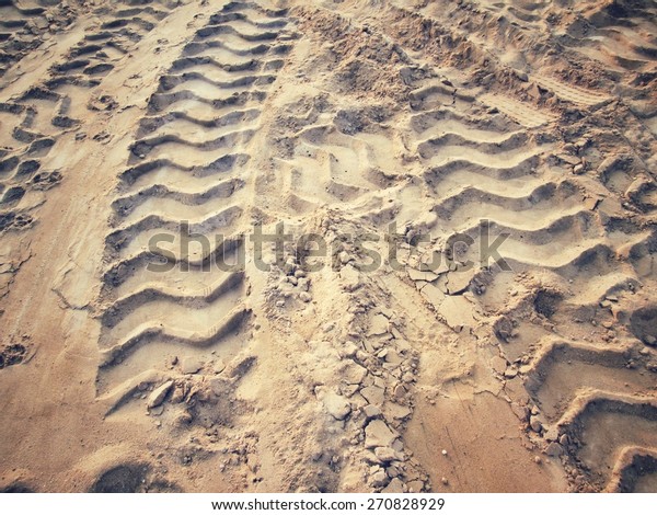 Wheel tracks on the\
soil.