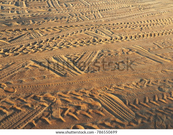 Wheel tracks on the soil and\
sand