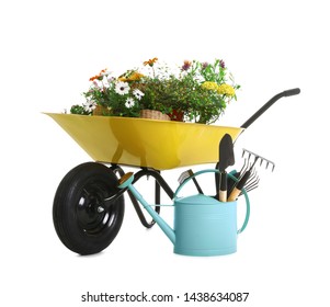 Wheelbarrow With Flowers And Gardening Tools Isolated On White