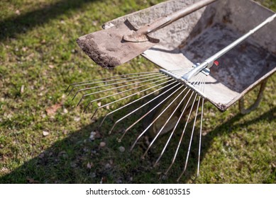 Wheelbarrow With Shovel And Rake