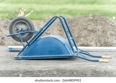 Wheelbarrows and pushcarts at a construction site

