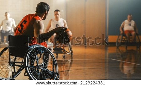 Wheelchair Basketball Game Court: Active Professional Player Dribbling Ball, Prepairing to Shoot and Score a Goal. Determination, Inspiration, and Skill of a People with Disability.