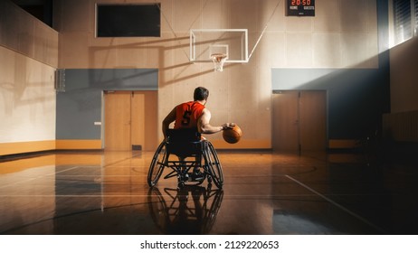 Wheelchair Basketball Player Dribbling Ball Like a Professional, Ready to Shoot and Score Goal. Determination, Motivation of a Person with Disability Excelling at Team Sport. Back View Shot - Powered by Shutterstock